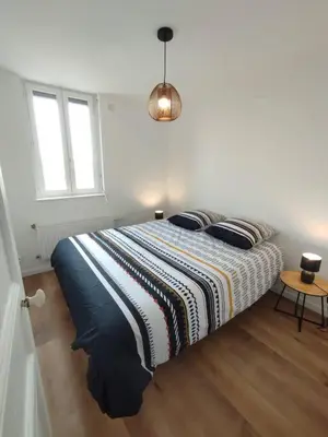 Un ou plusieurs lits dans un hébergement de l'établissement Le Petit Jacques, appartement & garage