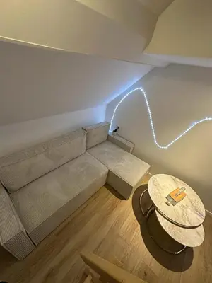 Coin salon dans l'établissement Appartement cocooning