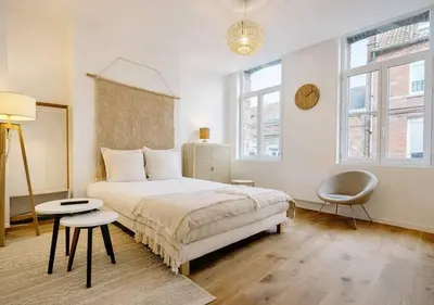 Un ou plusieurs lits dans un hébergement de l'établissement Spacious & Luxuary Studio