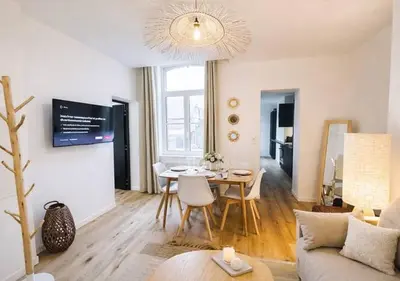 Télévision ou salle de divertissement dans l'établissement L'Escapade des Privilégiés