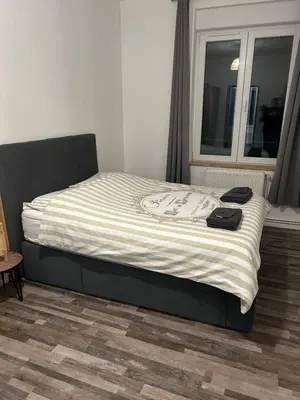 Un ou plusieurs lits dans un hébergement de l'établissement Appartement bord de seine