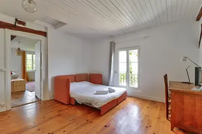 Un ou plusieurs lits dans un hébergement de l'établissement Grangebelle Maison 7 Chambres
