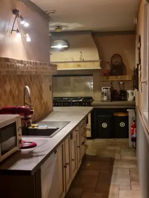Cuisine ou kitchenette dans l'établissement A la maison du bonheur