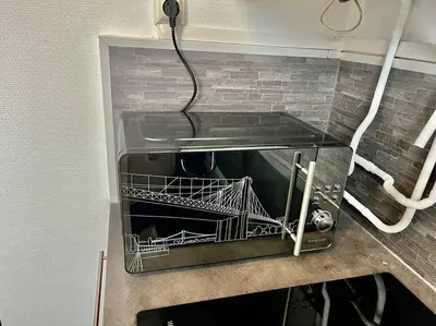 Cuisine ou kitchenette dans l'établissement Le Lovely avec parking