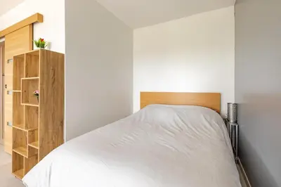 Un ou plusieurs lits dans un hébergement de l'établissement La Côte Verte Studio charme