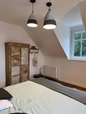 Un ou plusieurs lits dans un hébergement de l'établissement Le Magnolia Maison 12 Couchages