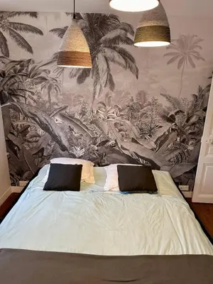 Un ou plusieurs lits dans un hébergement de l'établissement Le Magnolia Maison 12 Couchages