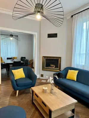 Coin salon dans l'établissement Le Magnolia Maison 12 Couchages