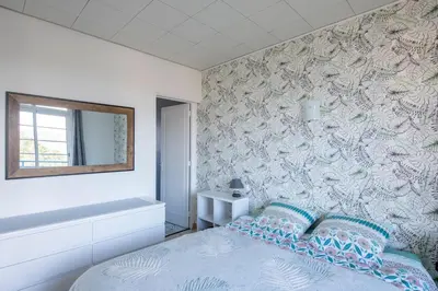 Un ou plusieurs lits dans un hébergement de l'établissement Mélodie - Bel appartement vue mer