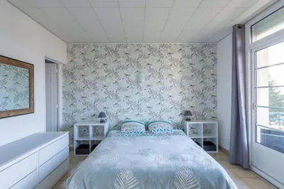 Un ou plusieurs lits dans un hébergement de l'établissement Mélodie - Bel appartement vue mer