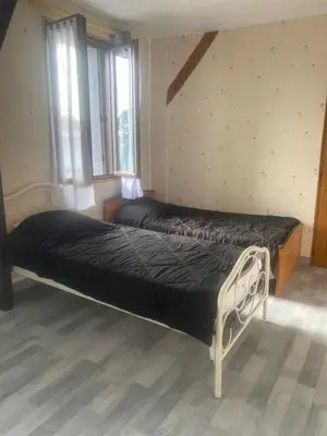 Un ou plusieurs lits dans un hébergement de l'établissement Maison calme