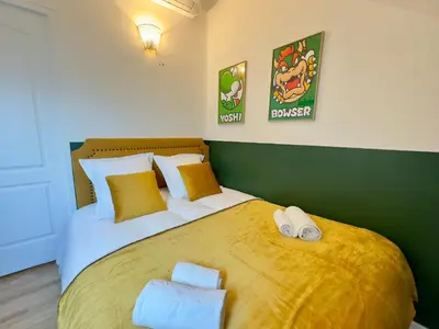 Un ou plusieurs lits dans un hébergement de l'établissement Maison 3ch - Cinéma - Game Room - Parking - Gare