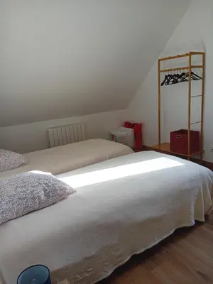 Un ou plusieurs lits dans un hébergement de l'établissement Gite Ferme du Marronnier