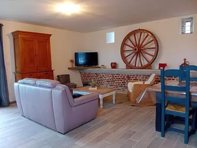 Télévision ou salle de divertissement dans l'établissement Gite Ferme du Marronnier