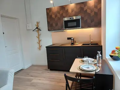 Cuisine ou kitchenette dans l'établissement L'escapade - A 5min à pied centre ville & gare