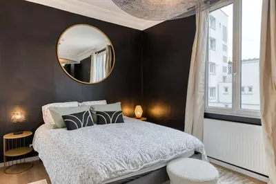 Un ou plusieurs lits dans un hébergement de l'établissement Appartement balnéo centre