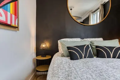 Un ou plusieurs lits dans un hébergement de l'établissement Appartement balnéo centre