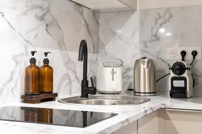 Cuisine ou kitchenette dans l'établissement Villa Caron - Appartements haut de gamme avec chambre hyper centre