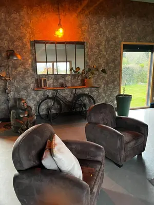 Coin salon dans l'établissement Suite avec salon prive 25m2 Wifi Netflix Duclair
