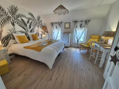 Un ou plusieurs lits dans un hébergement de l'établissement Le Cœur du Bien-être - Gîte grande capacité - 6 chambres - Superbe emplacement - Vue Seine - Décoration soignée - Coin touristique