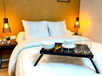 Un ou plusieurs lits dans un hébergement de l'établissement Chic Oasis in Rouen