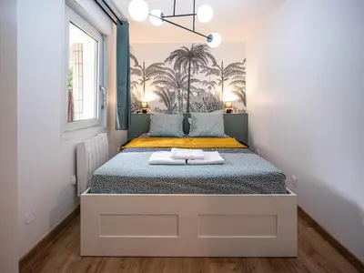 Un ou plusieurs lits dans un hébergement de l'établissement Appartement cocooning en centre-ville - Résidence le Colisée