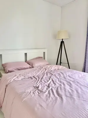 Un ou plusieurs lits dans un hébergement de l'établissement Home seventy - Guest House