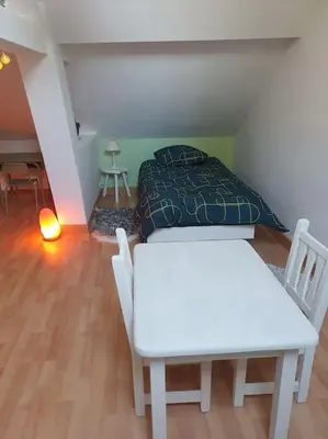 Un ou plusieurs lits dans un hébergement de l'établissement Charmante maison au bord des falaises