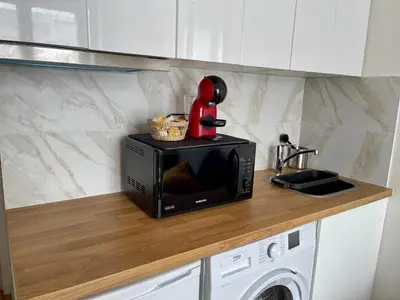 Cuisine ou kitchenette dans l'établissement Duplex cosy hyper centre