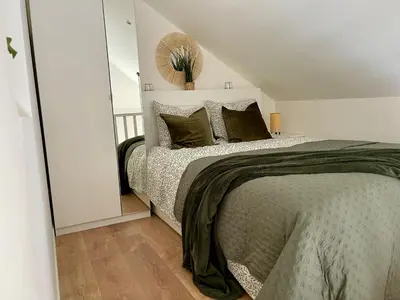 Un ou plusieurs lits dans un hébergement de l'établissement Duplex cosy hyper centre