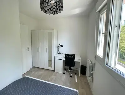 Un ou plusieurs lits dans un hébergement de l'établissement Appartement avec Loggia et Parking privé