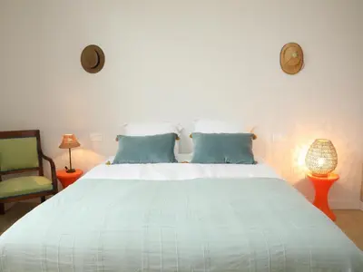 Un ou plusieurs lits dans un hébergement de l'établissement La Maison du Clocher by La Boîte En Plus
