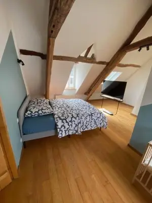 Un ou plusieurs lits dans un hébergement de l'établissement APPARTEMENT VICTOR HUGO