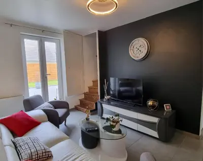 Télévision ou salle de divertissement dans l'établissement Chez IZZA Chambre au calme