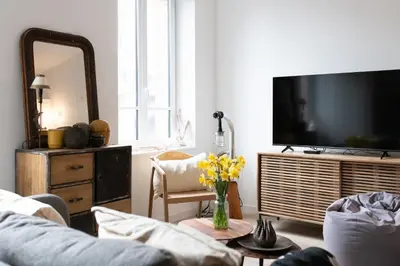 Télévision ou salle de divertissement dans l'établissement Le Méridien - app centre-ville