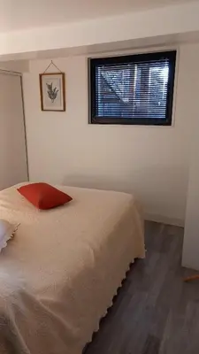Un ou plusieurs lits dans un hébergement de l'établissement Appartement individuel en maison