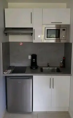 Cuisine ou kitchenette dans l'établissement Studio HAPPY'Home tout confort proche Rouen