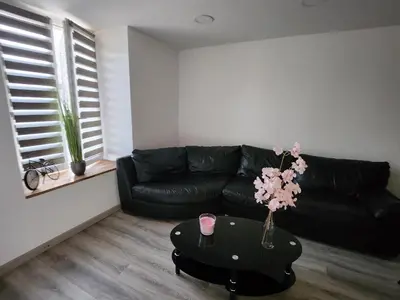 Coin salon dans l'établissement Maison de Ville à 40 km de Paris