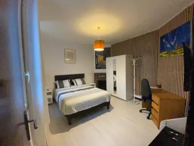 Un ou plusieurs lits dans un hébergement de l'établissement Studio cosy proche de Paris