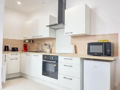 Cuisine ou kitchenette dans l'établissement Le 3 cailloux / 2 Chambre *Hyper centre*