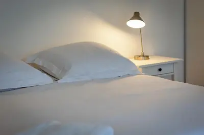 Un ou plusieurs lits dans un hébergement de l'établissement Daisy Un charmant appartement près de la Place du Vieux Marché