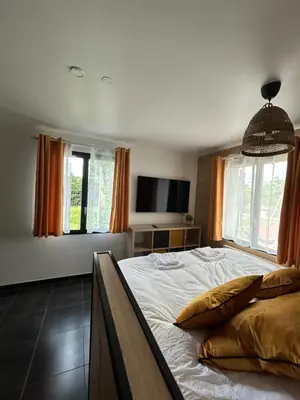 Un ou plusieurs lits dans un hébergement de l'établissement appartement ILLUSION