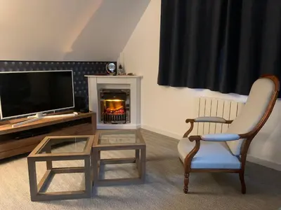 Télévision ou salle de divertissement dans l'établissement Au verger de la Pommeraye