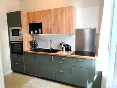 Cuisine ou kitchenette dans l'établissement Appartement Le Baron Cœur de Rouen - Normandie