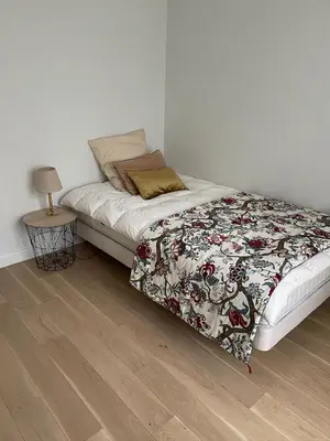 Un ou plusieurs lits dans un hébergement de l'établissement Modern family 3 bedroom apartment in the center of Maisons-Laffitte