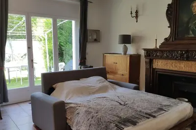 Un ou plusieurs lits dans un hébergement de l'établissement Charmant 110m2 avec jardin privé