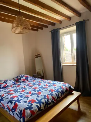 Un ou plusieurs lits dans un hébergement de l'établissement Charmante Maison Normande
