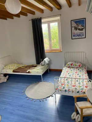 Un ou plusieurs lits dans un hébergement de l'établissement Charmante Maison Normande