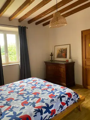Un ou plusieurs lits dans un hébergement de l'établissement Charmante Maison Normande