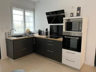 Cuisine ou kitchenette dans l'établissement Maison de vacances